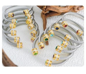 Detailed cable wire bangle with colorful gemstones and elegant gold accents