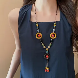 Bohemian ethnic handmade woven necklace with colorful ceramic beads and tassel pendants