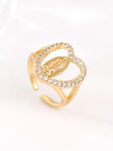 Detailed view of gold Mary relief heart ring with zircon inlay and open band design
