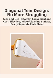 Detail of slant-tear sticky lint roller removing dust and debris from white adhesive paper