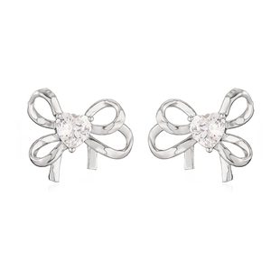 Silver bow stud earrings with heart-shaped white zircon in a minimalist luxury design
