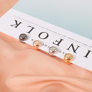 Detailed macro of magnetic scarf buckles in gold, silver, rose gold and gunmetal finish
