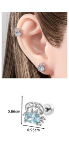 Detail showing a silver crab earring with light blue gem and dimensions of 0.86cm by 0.95cm