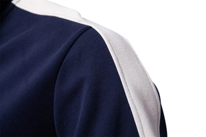 Detailed close-up of shoulder seam and blue-white stitching on the men's sports sweatshirt
