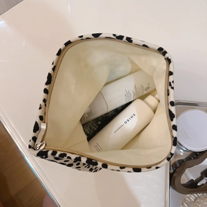 Vintage black and white leopard print canvas makeup bag with gold zipper and large interior