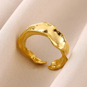 Detailed macro view of the irregular molten gold texture on this adjustable open ring