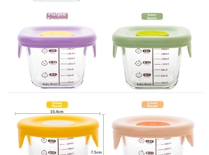 Detail of 200ml glass baby food containers with colorful silicone lids and scale marks