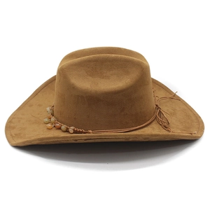 Detail view of brown suede cowboy hat with ethnic beaded band and side bow decoration