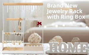 Detail of white metal jewelry rack with wooden bar and beige velvet ring storage box