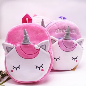 Cute unicorn plush backpack for children featuring soft pink fur and silver spiral horn