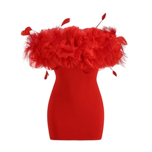 Detail of red tube dress featuring textured feather trim and floral neckline accents
