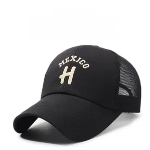 Close-up of beige MEXICO H letter embroidery and breathable mesh on black baseball cap