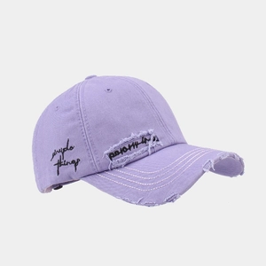 Detailed side view of distressed lavender cotton baseball cap with simple things embroidery