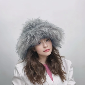 Detail shot of fluffy grey faux fur texture on a punk style winter plush beanie hat