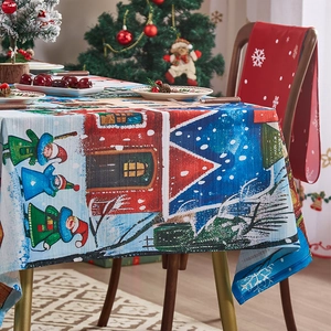 Detailed Christmas tablecloth featuring snowman and snowflake prints in festive setting