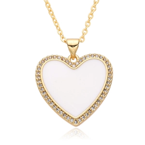 Detailed view of heart pendant necklace with white enamel center and zircon border