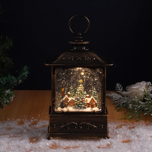 Close-up of bronze vintage Christmas lantern with internal house scene and swirling snow