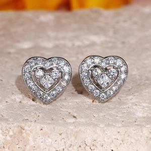 Elegant mini heart stud earrings with silver metal and sparkling pave-set cubic zirconia