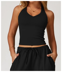 Close-up of black brushed yoga vest featuring V-neck design and tight fit athletic fabric