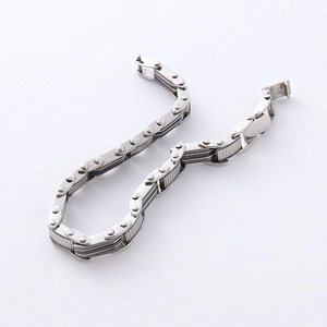 Macro view of polished silver stainless steel link chain bracelet with industrial sawtooth texture