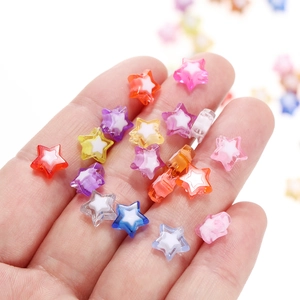 Colorful acrylic star beads for DIY jewelry and phone chain accessories shown in hand