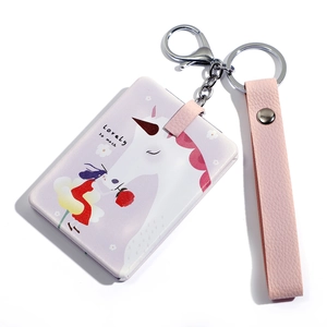 Pink leather keychain card holder with unicorn illustration and wristlet strap