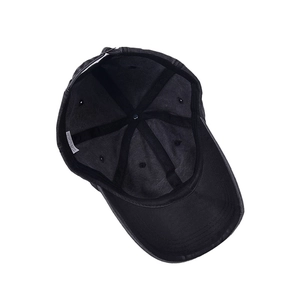 Internal view of a black washed cotton baseball cap with adjustable buckle and stitching