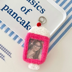 Close-up of pink plush bunny card holder with soft fur texture and transparent photo window