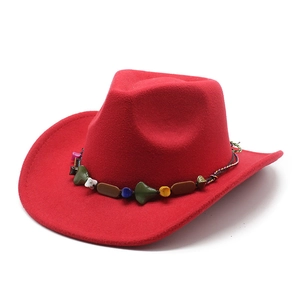 Red wool felt western cowboy hat with vintage ethnic beaded rope trim on white background