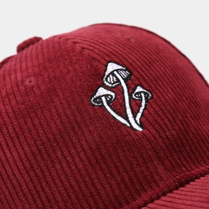 Burgundy corduroy baseball cap featuring detailed mushroom embroidery for outdoor sun protection