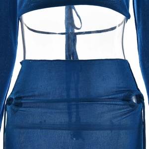 Detail view of blue knit fabric texture and seam design at waist and hip area