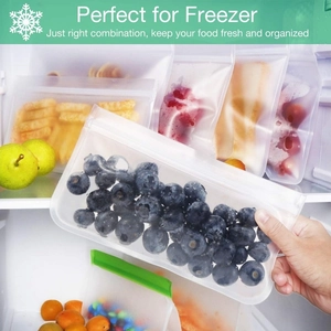 Reusable PEVA food storage bags for freezer organization shown with fresh blueberries