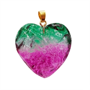 Macro shot of heart-shaped crystal pendant with pink green gradient and cracked texture