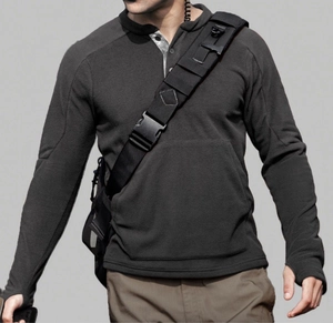 Detail of men's charcoal tactical fleece shirt featuring thumbhole cuffs and a henley neck