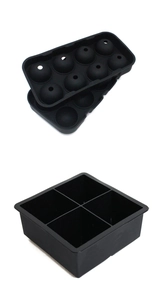 Detail of black silicone ice cube trays for large spheres and square blocks