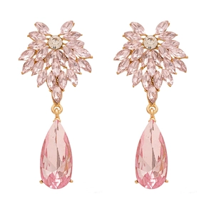 Elegant gold earrings with pink teardrop crystals and floral studs on a white background