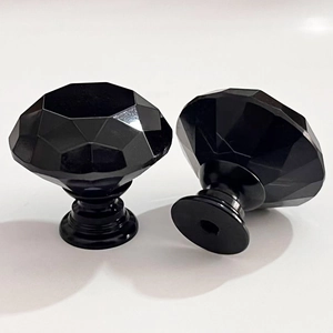Modern crystal cabinet knobs with black base and multi-faceted glass design for furniture
