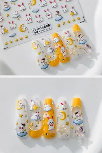 Detail view of 3D embossed nail art stickers with moon rabbit and star patterns