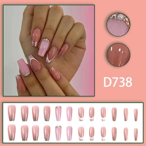 Long coffin press-on nails with pink gradient, French tips, glitter, and pearl accents