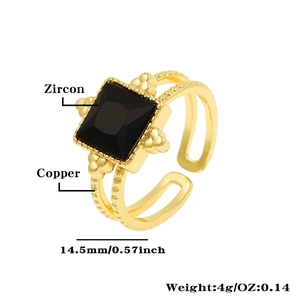 Detailed specs of geometric ring with black zircon and dimensions on white background