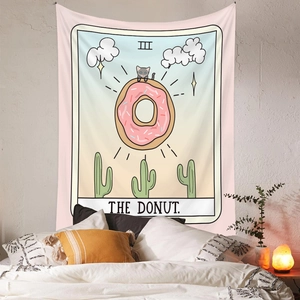 Close-up of The Donut tarot tapestry with a cute cat and pink donut design on wall