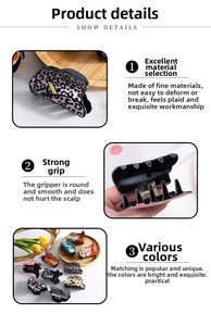 Macro view of patterned hair claws featuring leopard and cow prints with spring mechanism