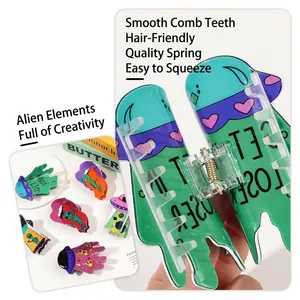 Cartoon alien and UFO acrylic hair claw clips in vibrant green and purple colors