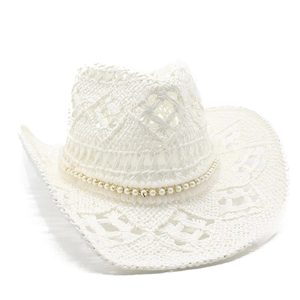 Detailed view of white woven cowboy straw hat featuring pearl and gold chain trim