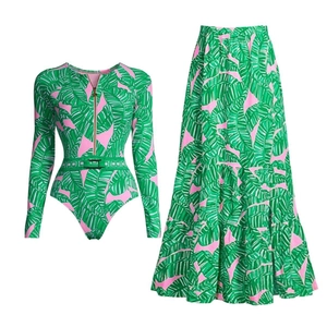 Detail of tropical banana leaf print swimwear with zipper top and tiered maxi skirt