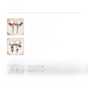 Detailed view of colorful crystal flower earrings with long tassels and copper material