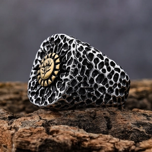 Macro detail of retro punk skull ring with honeycomb texture and relief patterns
