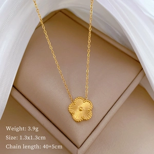 Detail view of 18K gold plated flower necklace with measurements in a beige jewelry box