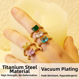 Macro shot of 18K gold plated titanium rings with colorful square-cut gemstones