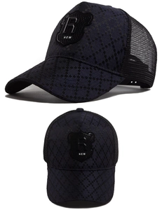 Detail of checkered baseball cap with breathable mesh and R shield patch embroidery